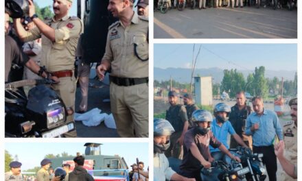 Police distributes crash helmets to bikers in Kulgam