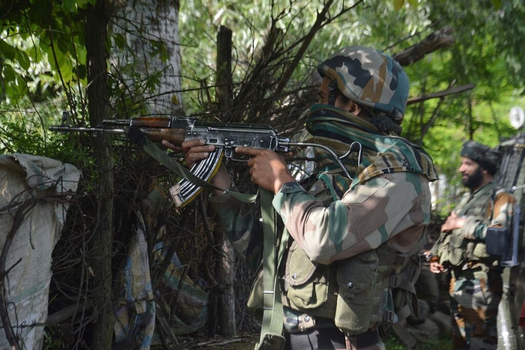 Anantnag: A security personnel takes position during a gunfight with militants in Jammu and Kashmir's Anantnag, on June 8, 2019. One Jaish-e-Muhammad (JeM) militant was killed in the gunfight. (Photo: IANS) FORCES
