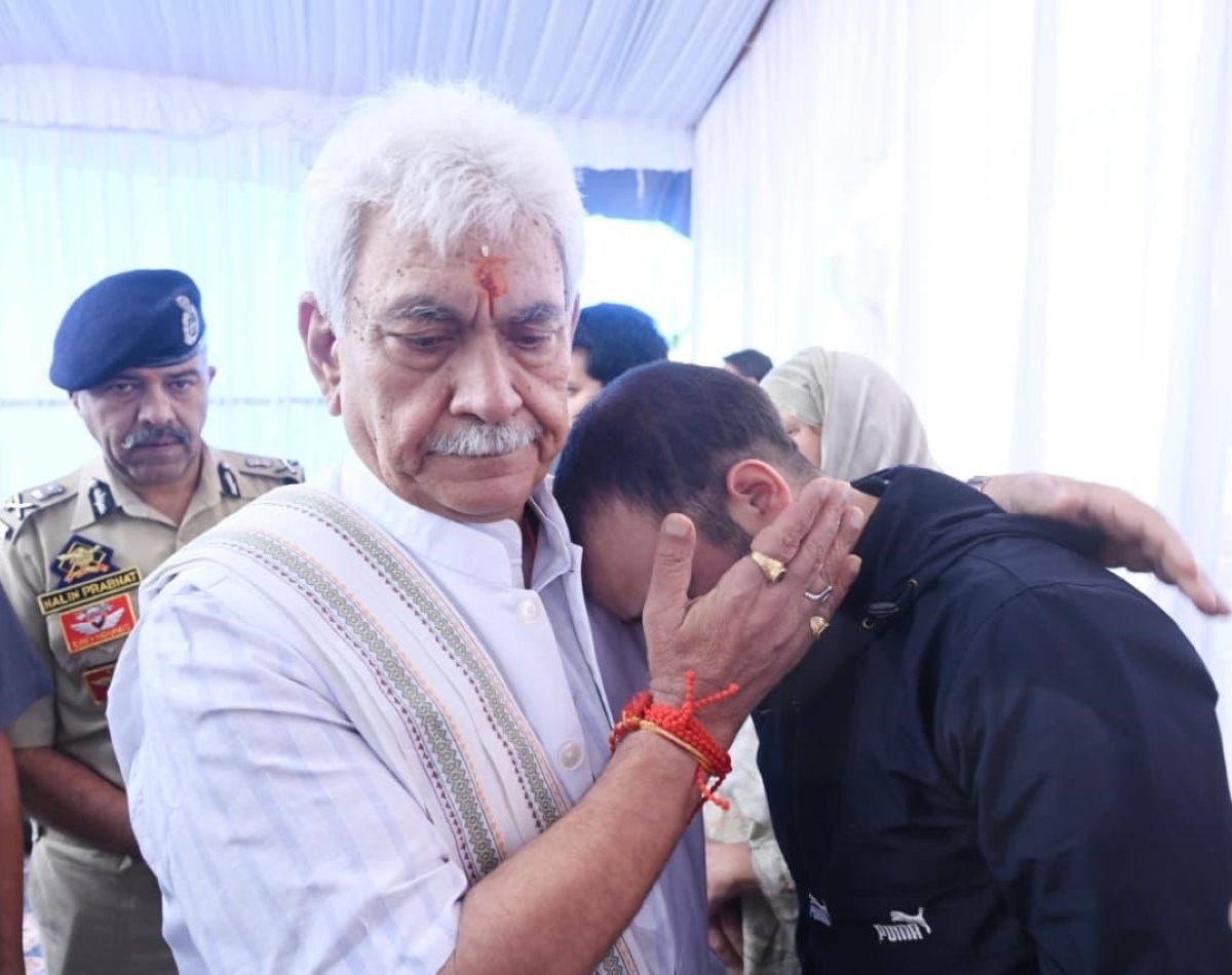 LG Sinha visits family of cop killed in Anantnag, assures full support